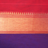 Handwoven deep red consecrated cotton saree with a vibrant royal blue border