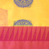 Handwoven yellow consecrated cotton saree with lotus patterns crafted in pink and royal blue