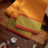 Devi Energised Cotton Saree – Golden Orange with Olive Green & Rust Red Woven Border