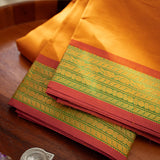 Devi Energised Cotton Saree – Golden Orange with Olive Green & Rust Red Woven Border