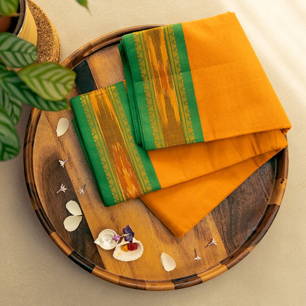 Devi Consecrated Cotton Saree – Saffron Orange with Emerald Green & Golden Woven Border