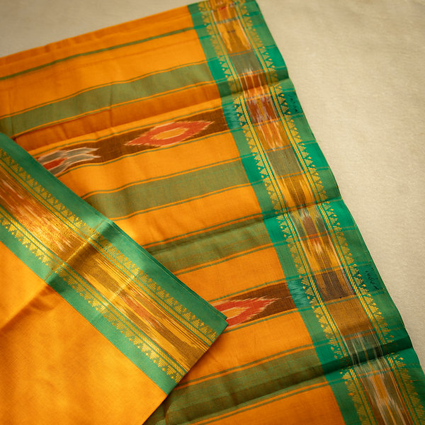 Devi Consecrated Cotton Saree – Saffron Orange with Emerald Green & Golden Woven Border