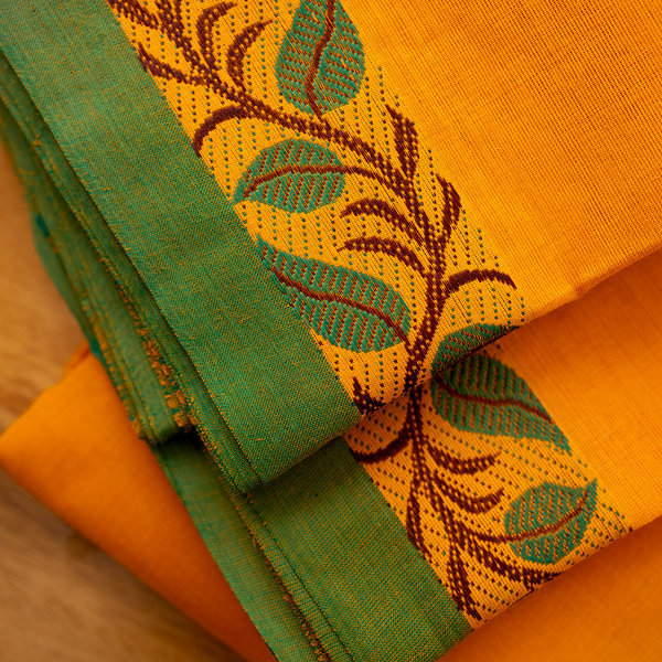 Devi Energised Cotton Saree – Saffron Orange with Green Border