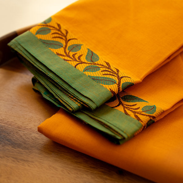 Devi Energised Cotton Saree – Saffron Orange with Green Border