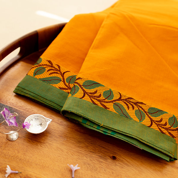 Devi Energised Cotton Saree – Saffron Orange with Green Border