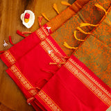 Devi Energised Cotton Saree – Golden Orange with Olive Green Floral Motifs & Vibrant Red Traditional Border