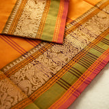 Devi Energised Cotton Saree – Golden Orange with Olive Green & Rust Red Traditional Floral Border