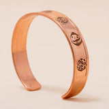 Chakra copper cuff. Crafted with the mantras of the seven chakras.