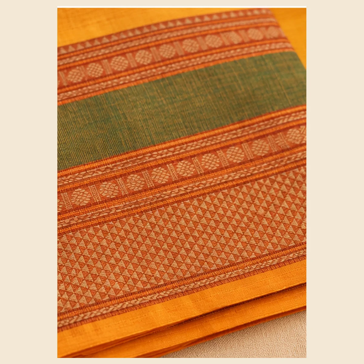 Devi Energised Cotton Saree – Saffron Orange with Olive Green & Rust Border